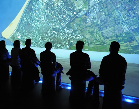 Immersive Design at World Expo Zaragoza: Dutch Pavilion Exhibition. Experience the essence of Water and Sustainable Development through our captivating Dutch Pavilion exhibition. As visitors stand on the 'shore,' they are treated to a cinematic journey about water and the Netherlands through an impressive floor and wall projection. Design by Studio Königshausen.